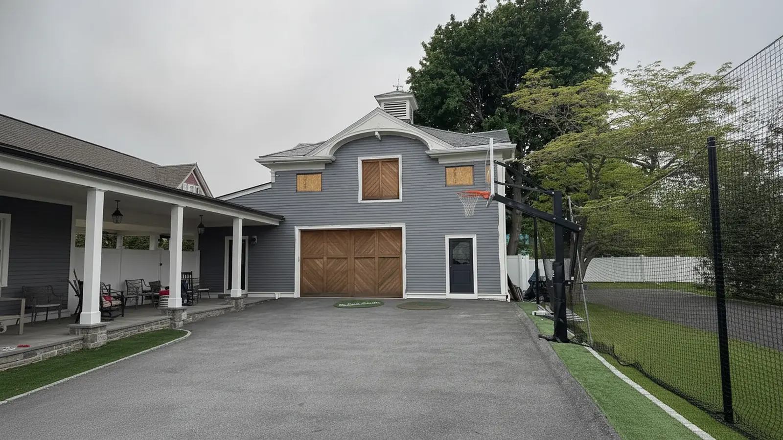 Gray house and garage with painted trim