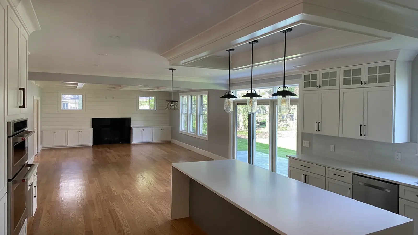 Open kitchen and living room with freshly painted walls and ceiling
