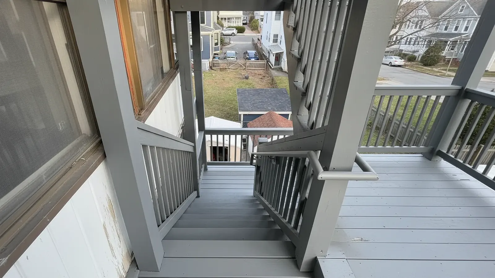 Porch stairs painted with gray railings