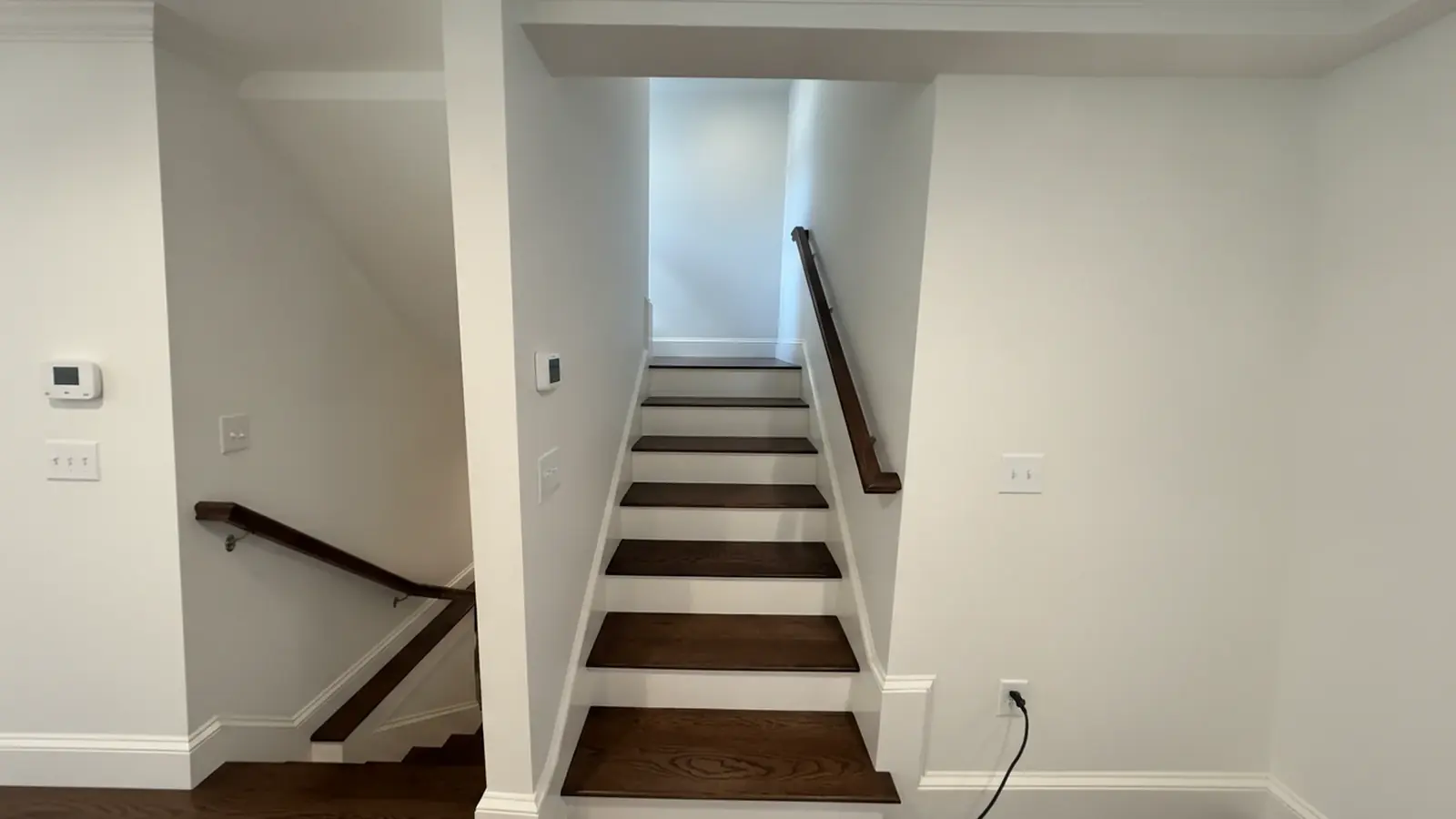 Staircase with painted white risers and dark treads