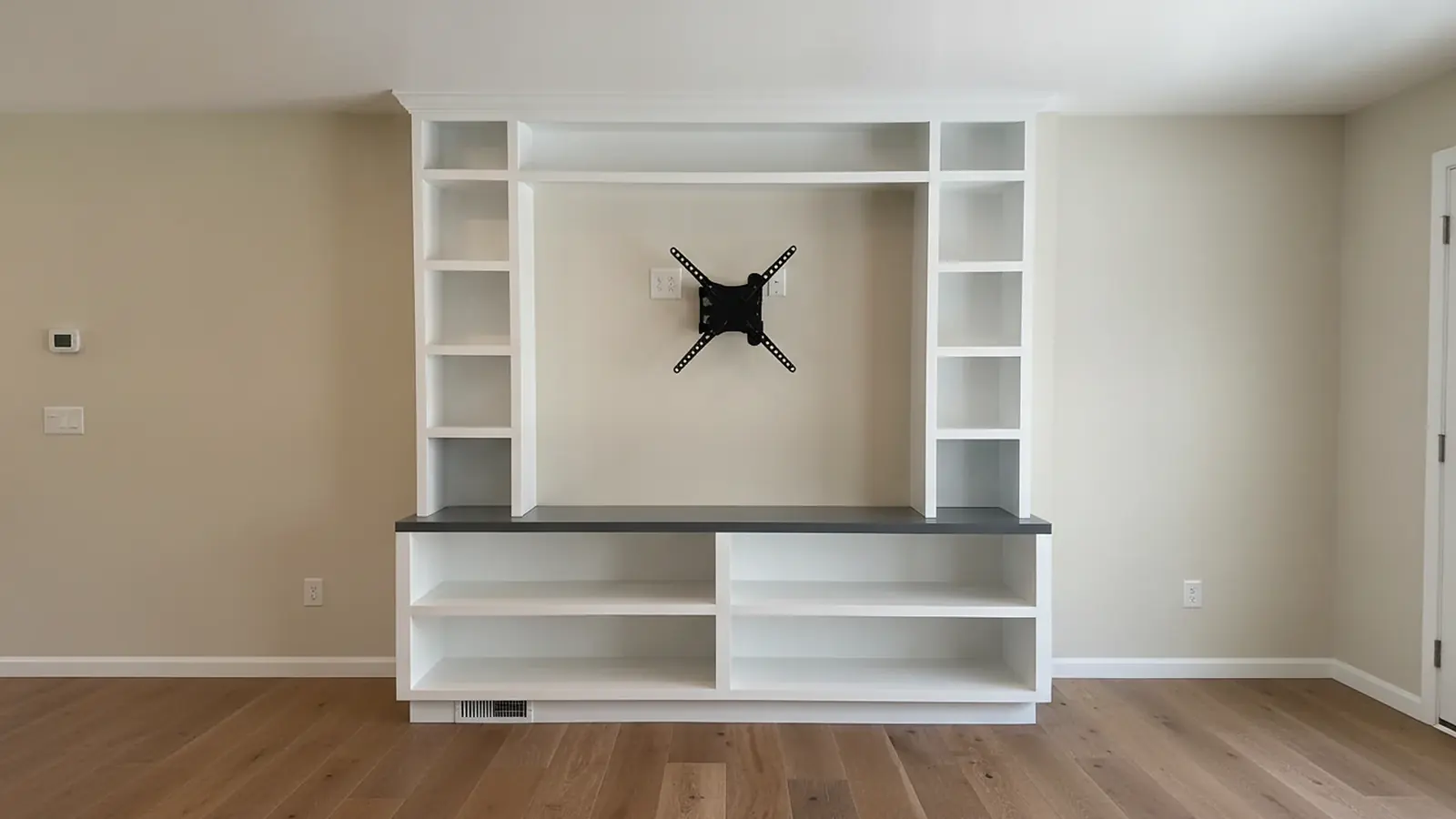 White spray-finished built-in shelves